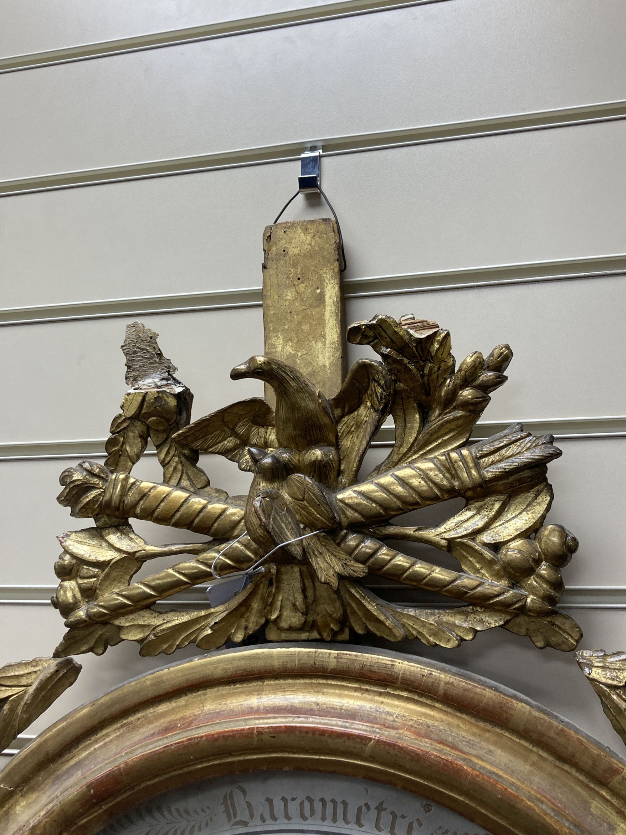 A 19th century French carved giltwood barometer / thermometer, width 68cm, height 92cm